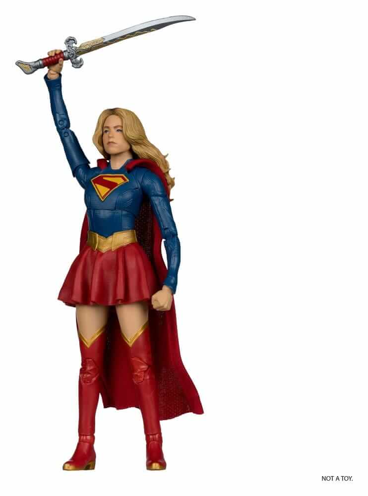 Supergirl (2026) DC Theatrical Deluxe Edition Actionfigur Supergirl & Baby Krypto 17 cm in action with sword.